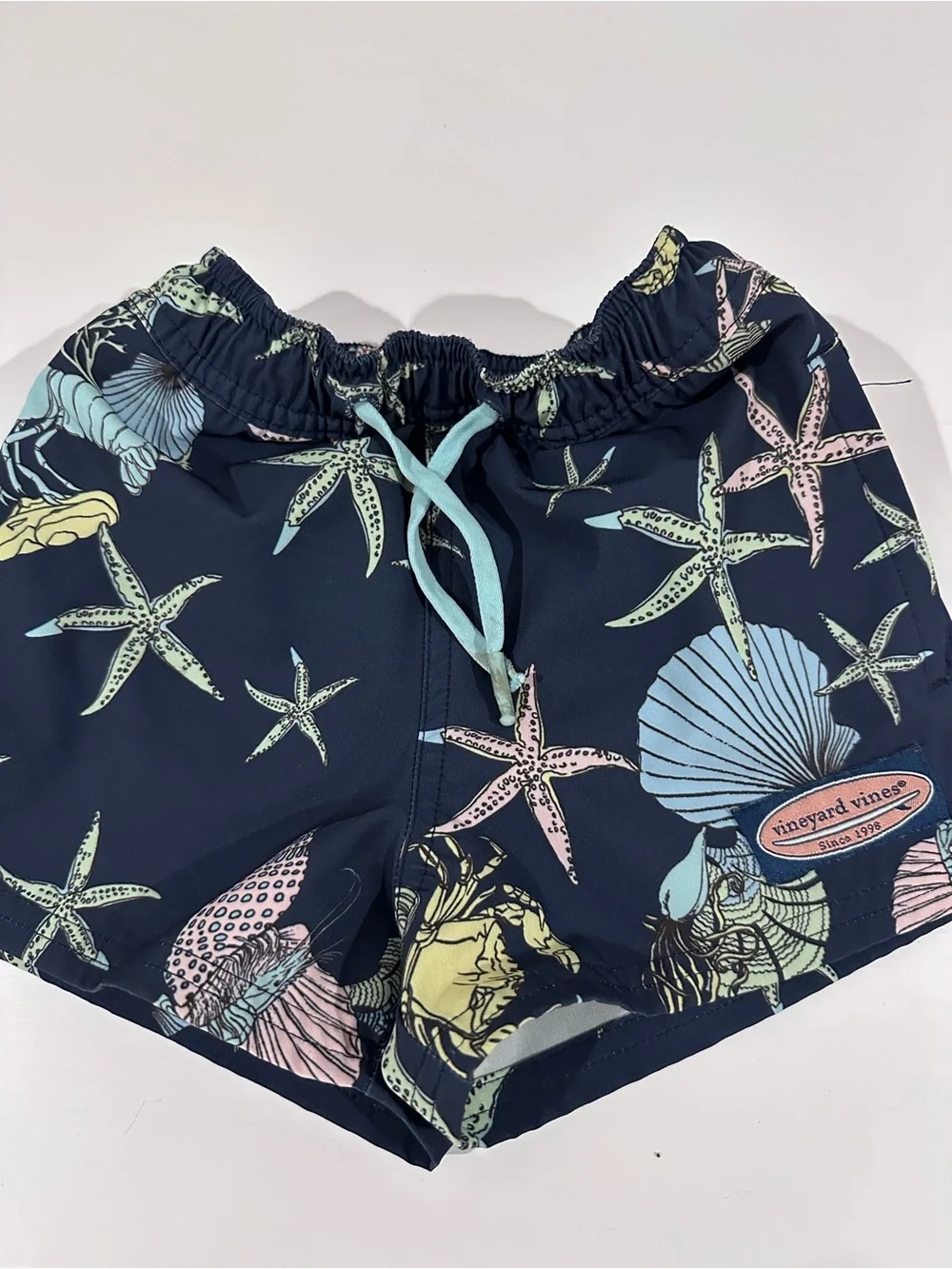Vineyard Vines Navy Swim Trunks with Pastel Sea Life Print